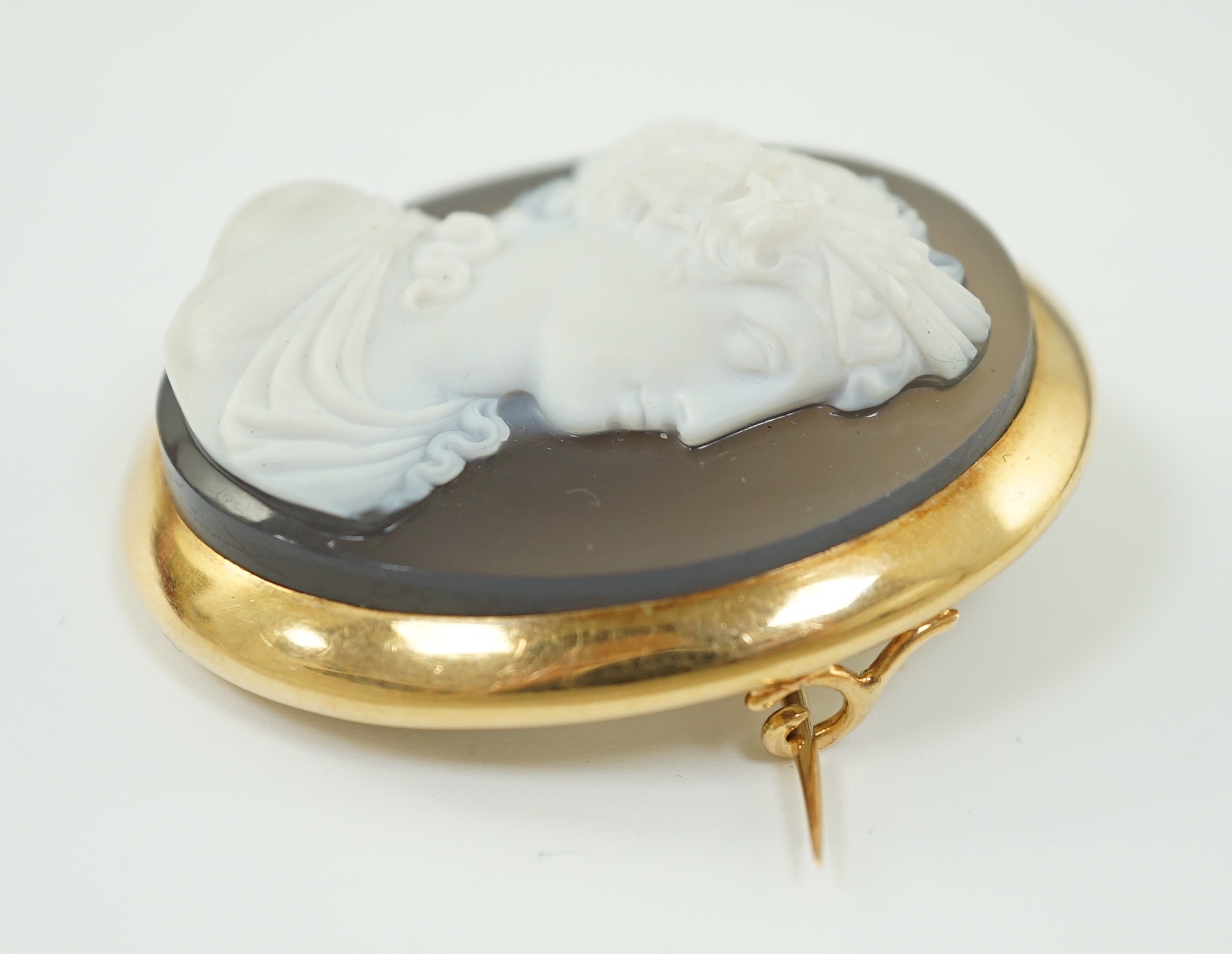 A late 19th/early 20th century gold mounted chalcedony cameo set oval brooch